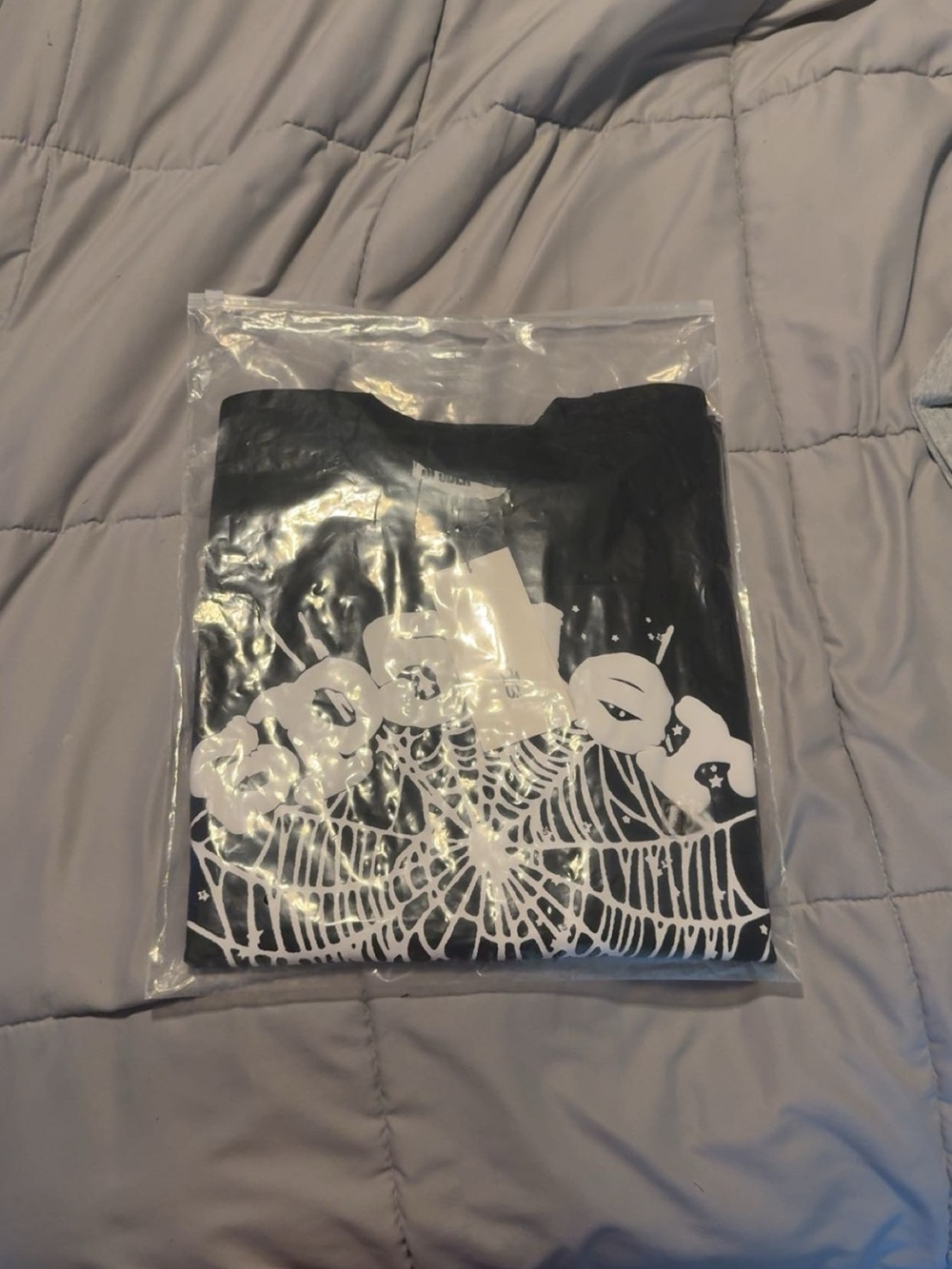 Black Short-Sleeve Graphic Tee with White Web Design